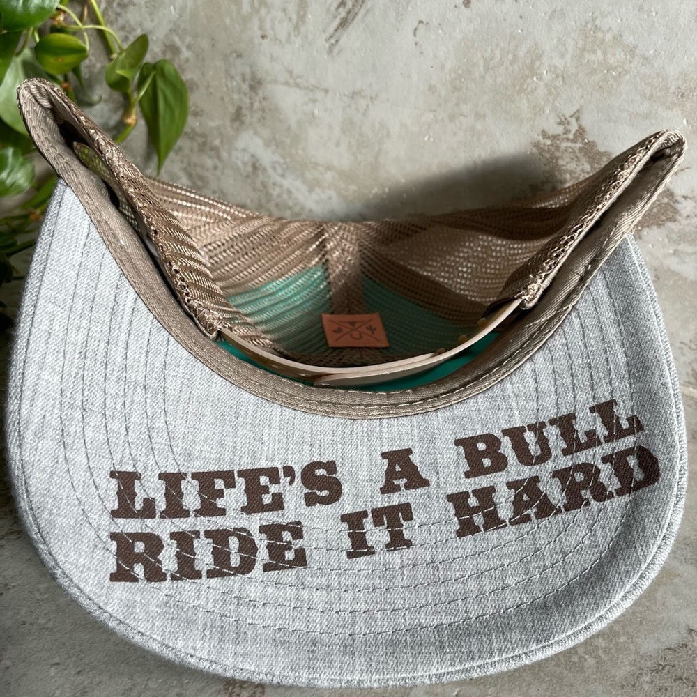 Women's snap back hat. New without tags. "Life is a Bull, Ride it Hard."